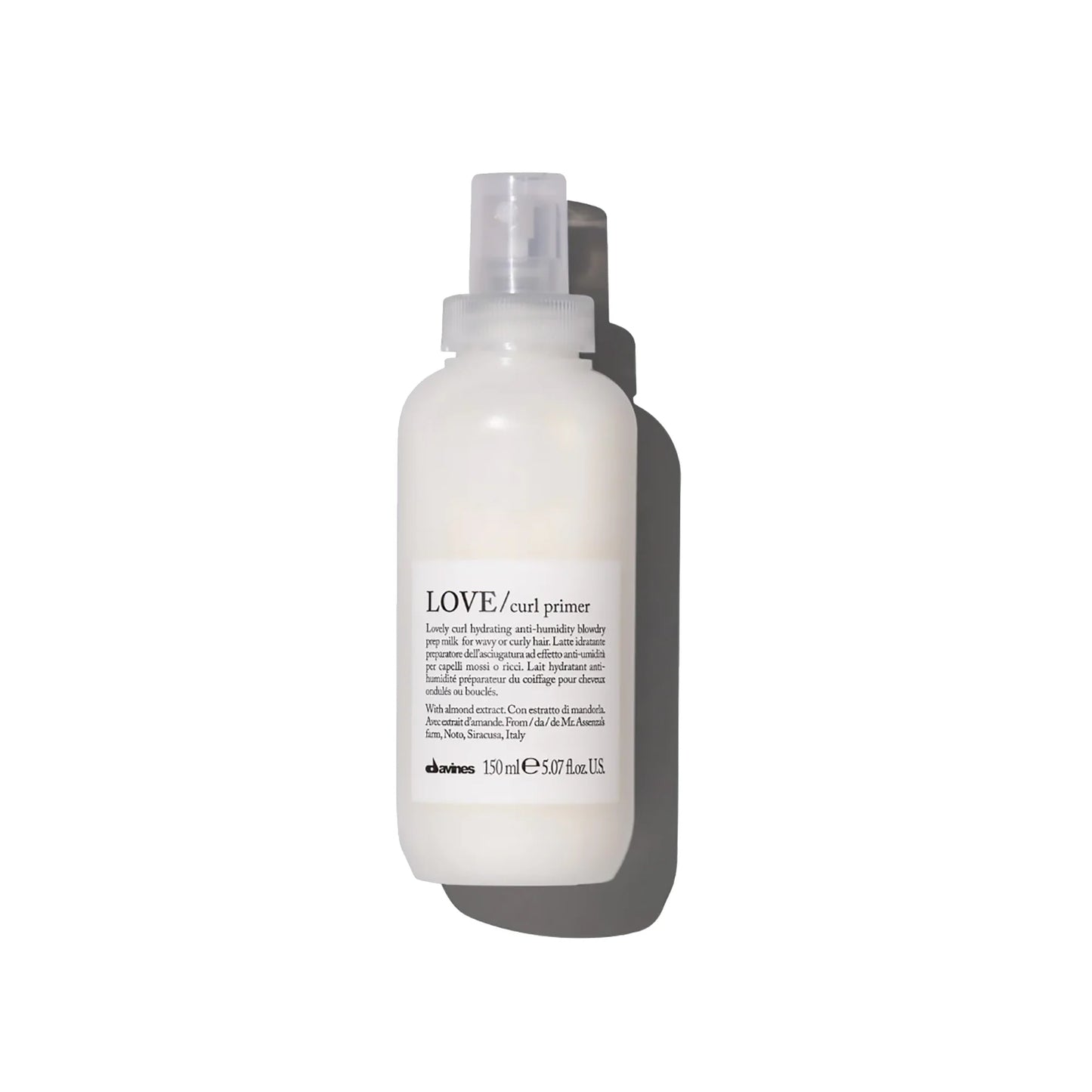 White bottle of Davines LOVE curl primer on a white background