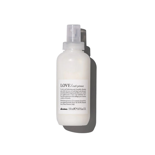White bottle of Davines LOVE curl primer on a white background